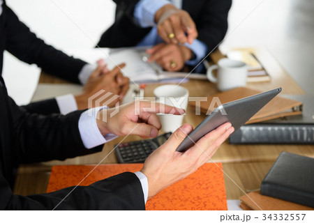 businessman team discuss project using tablet businessman team discuss project using tablet 34332557