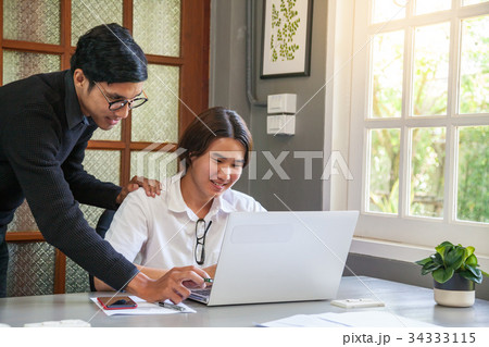 Young teacher and student 34333115