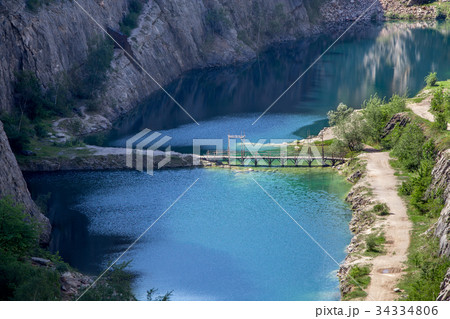Blue lagoon at the bottom of canyon 34334806