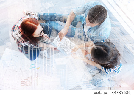 Top view of smart coworkers in the office Top view of smart coworkers in the office 34335686