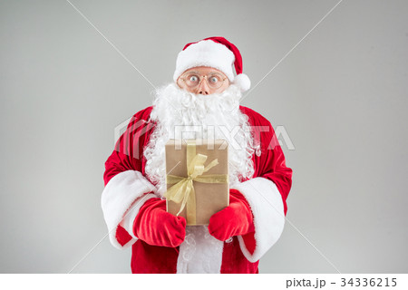 Excited mature Santa keeping present Excited mature Santa keeping present 34336215