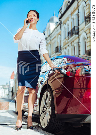 Confident intelligent businesswoman multitasking Confident intelligent businesswoman multitasking 34338078