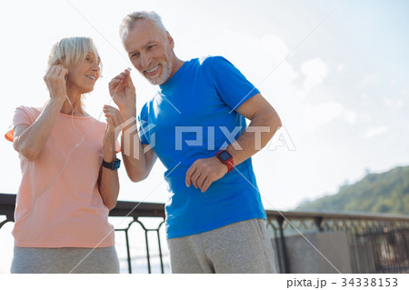 Lovely senior couple listening to the music Lovely senior couple listening to the music 34338153