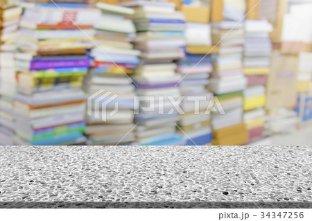 Marble table with library blur background Marble table with library blur background 34347256