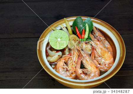 Tom Yum, Shrimp clear soup on wooden background. 34348287