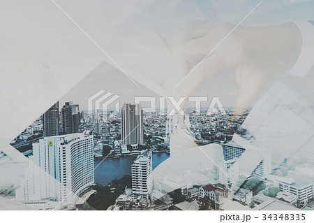 Double exposure of businessman working in office with digital ta 34348335