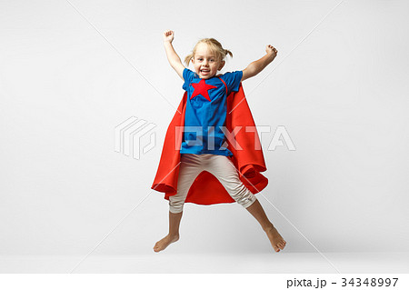 Very excited little girl dressed like superhero 34348997
