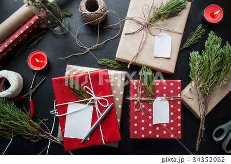 A christmas gift with greetings card on the table A christmas gift with greetings card on the table 34352062
