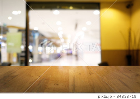 Empty dark wooden table blurred background 34353719