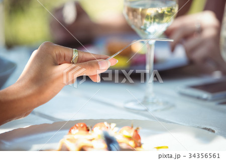 Woman having meal in restaurant 34356561