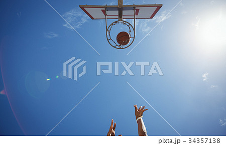 Directly below shot of person playing basketball Directly below shot of person playing basketball 34357138