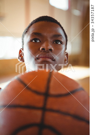 Thoughtful teenage basketball player Thoughtful teenage basketball player 34357187
