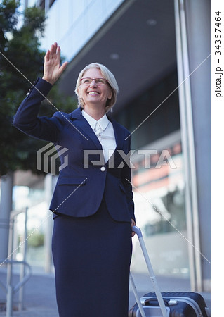 Smiling businesswoman gesturing 34357464