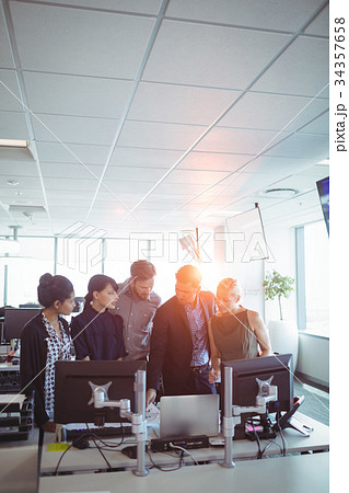 Business people working together in office Business people working together in office 34357658