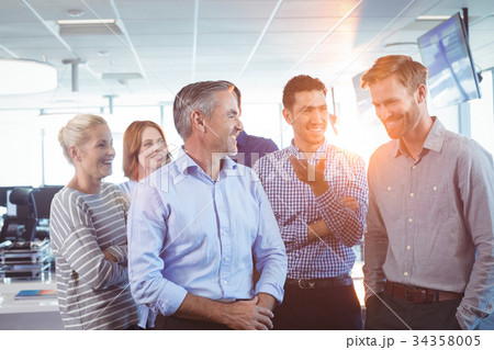 Happy business colleagues at office Happy business colleagues at office 34358005
