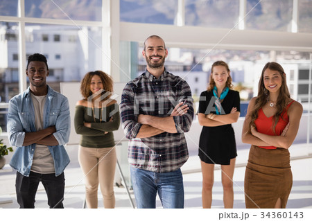 Group of colleagues standing with arms crossed 34360143