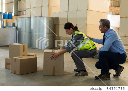 Manager motivating female worker while working 34361736