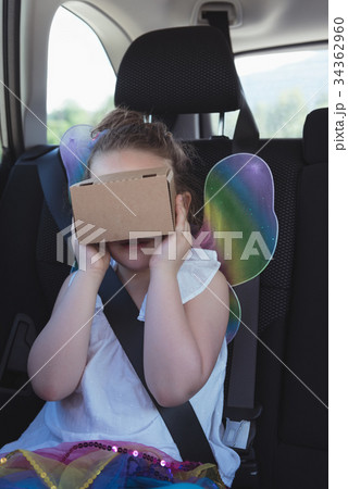 Girl pretending to use virtual reality headset Girl pretending to use virtual reality headset 34362960