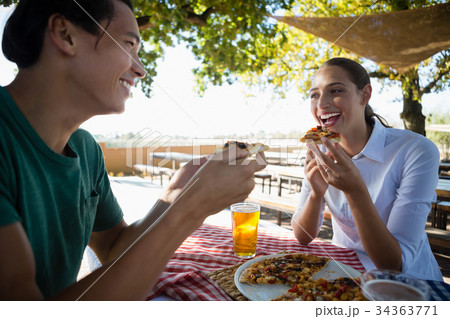 Happy friends having pizza 34363771
