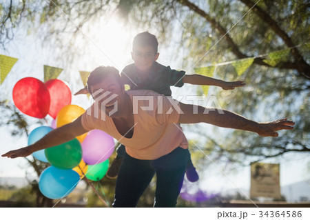 Father and son enjoying together in the park 34364586