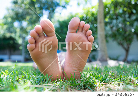 Low section of girl relaxing in yard 34366557