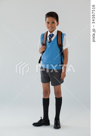 Schoolboy in school uniform with school bag on white background Schoolboy in school uniform with school bag on white background 34367516