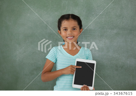 Young girl holding digital tablet 34367615