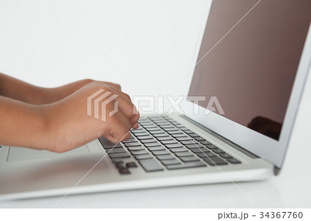 Schoolboy using laptop Schoolboy using laptop 34367760