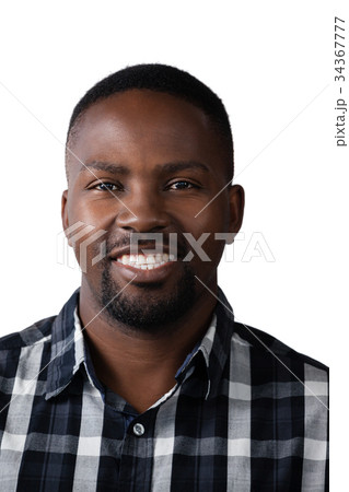 Smiling man standing against white background Smiling man standing against white background 34367777