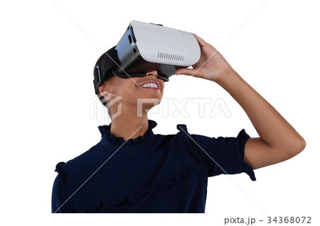 Woman using virtual reality headset 34368072