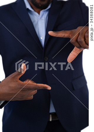 Businessman forming a finger frame 34368081