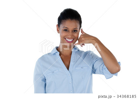 Businesswoman pretending to talk on a cell phone 34368185
