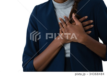 Mid section of woman suffering from chest pain Mid section of woman suffering from chest pain 34368484