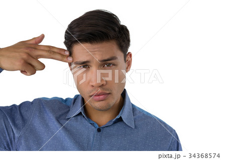 Portrait of businessman with suicide gesture 34368574