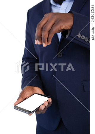 Businessman using mobile phone 34368588