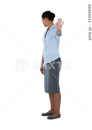 Businesswoman showing her hand while ignoring 34369098