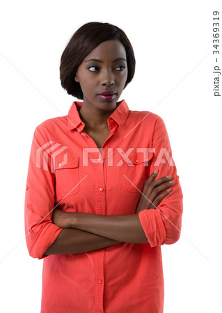 Young woman with arms crossed looking away 34369319