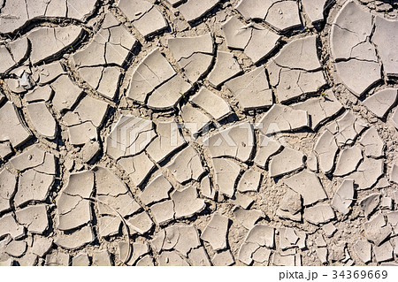Cracked dry land in a desert 34369669