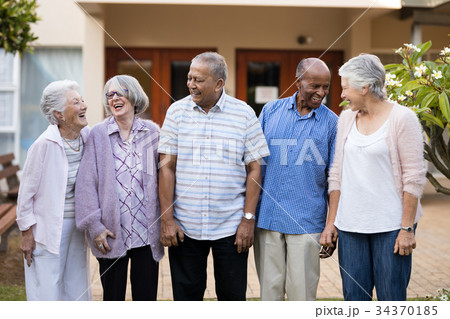 Cheerful senior men and women at nursing home 34370185