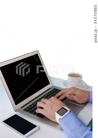High angle view of businessman working on laptop High angle view of businessman working on laptop 34370860