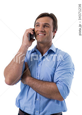 Male executive talking on mobile phone Male executive talking on mobile phone 34371236