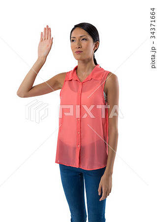 Woman gesturing against white background 34371664