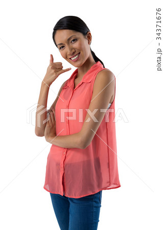 Beautiful woman gesturing against white background Beautiful woman gesturing against white background 34371676