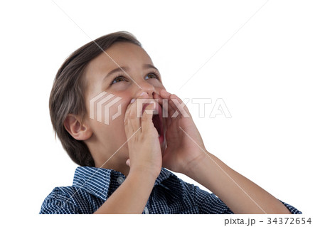 Cute boy shouting against white background Cute boy shouting against white background 34372654