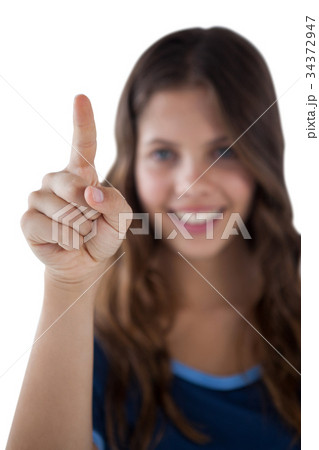 Girl pressing an invisible virtual screen 34372947