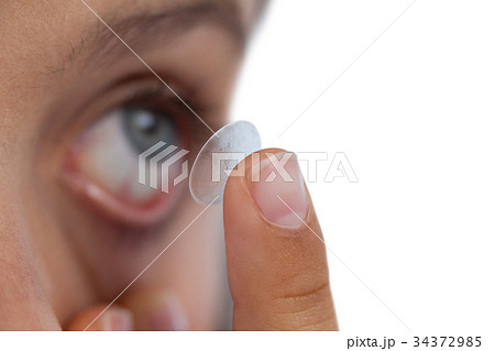 Girl wearing lenses against white background 34372985