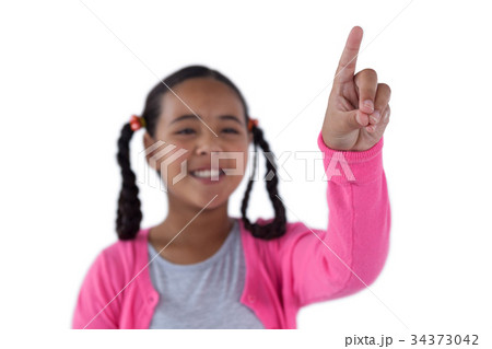 Girl pressing an invisible virtual screen 34373042