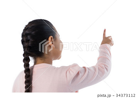 Girl pretending to touch an invisible screen 34373112