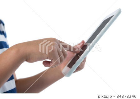Mid section of girl using digital tablet Mid section of girl using digital tablet 34373246