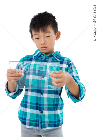Boy using a glass digital tablet 34373313